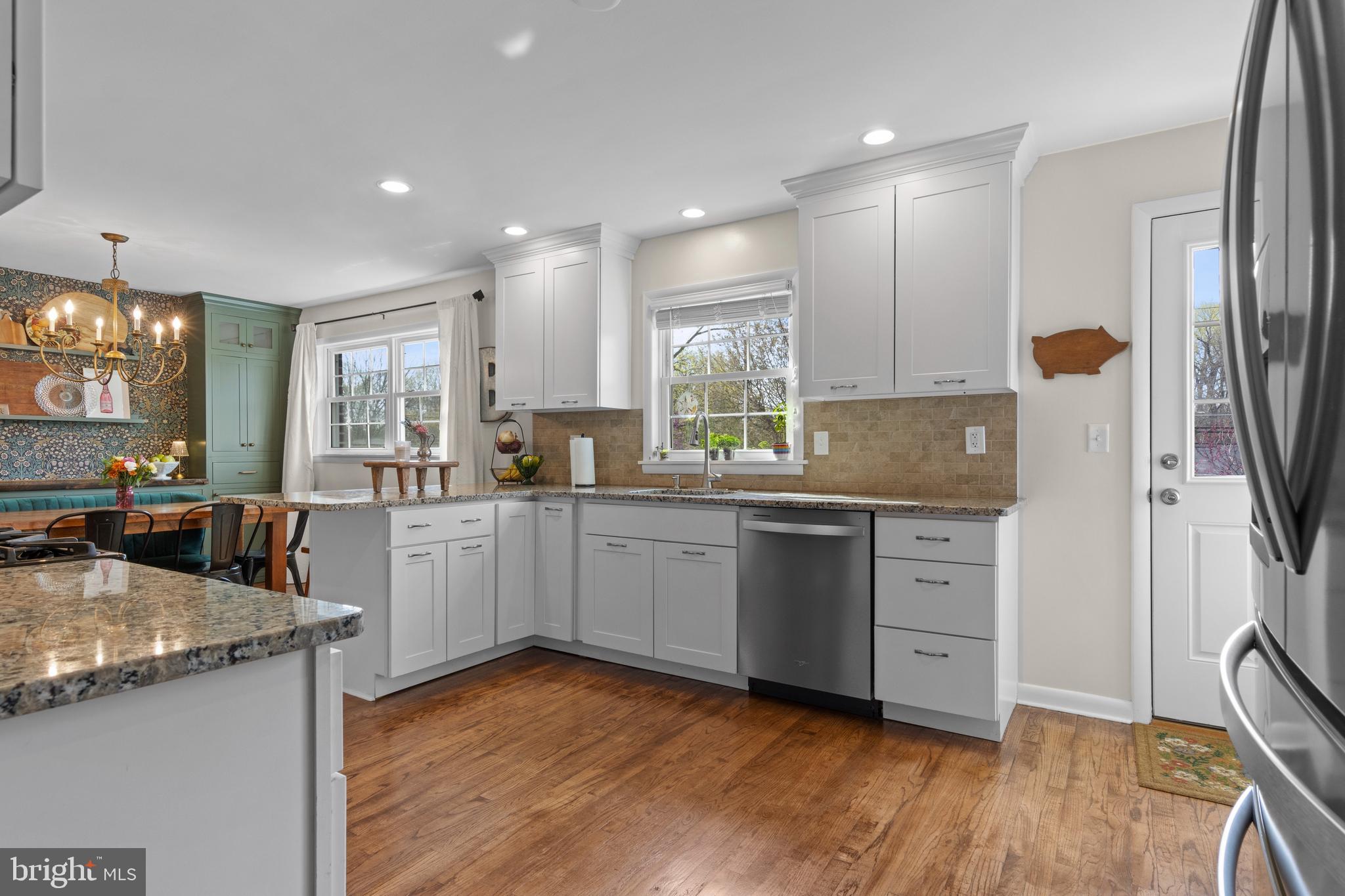 502 Ridge Avenue Kennett Square, PA 19348 - Photo 23 of 60 a kitchen with granite countertop a sink appliances and cabinets