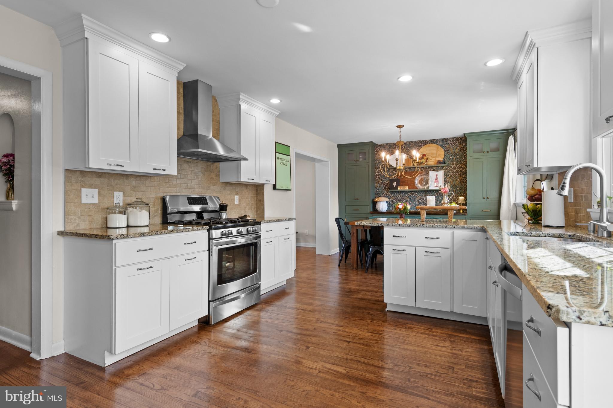 502 Ridge Avenue Kennett Square, PA 19348 - Photo 24 of 60 a kitchen with granite countertop a sink cabinets and stainless steel appliances
