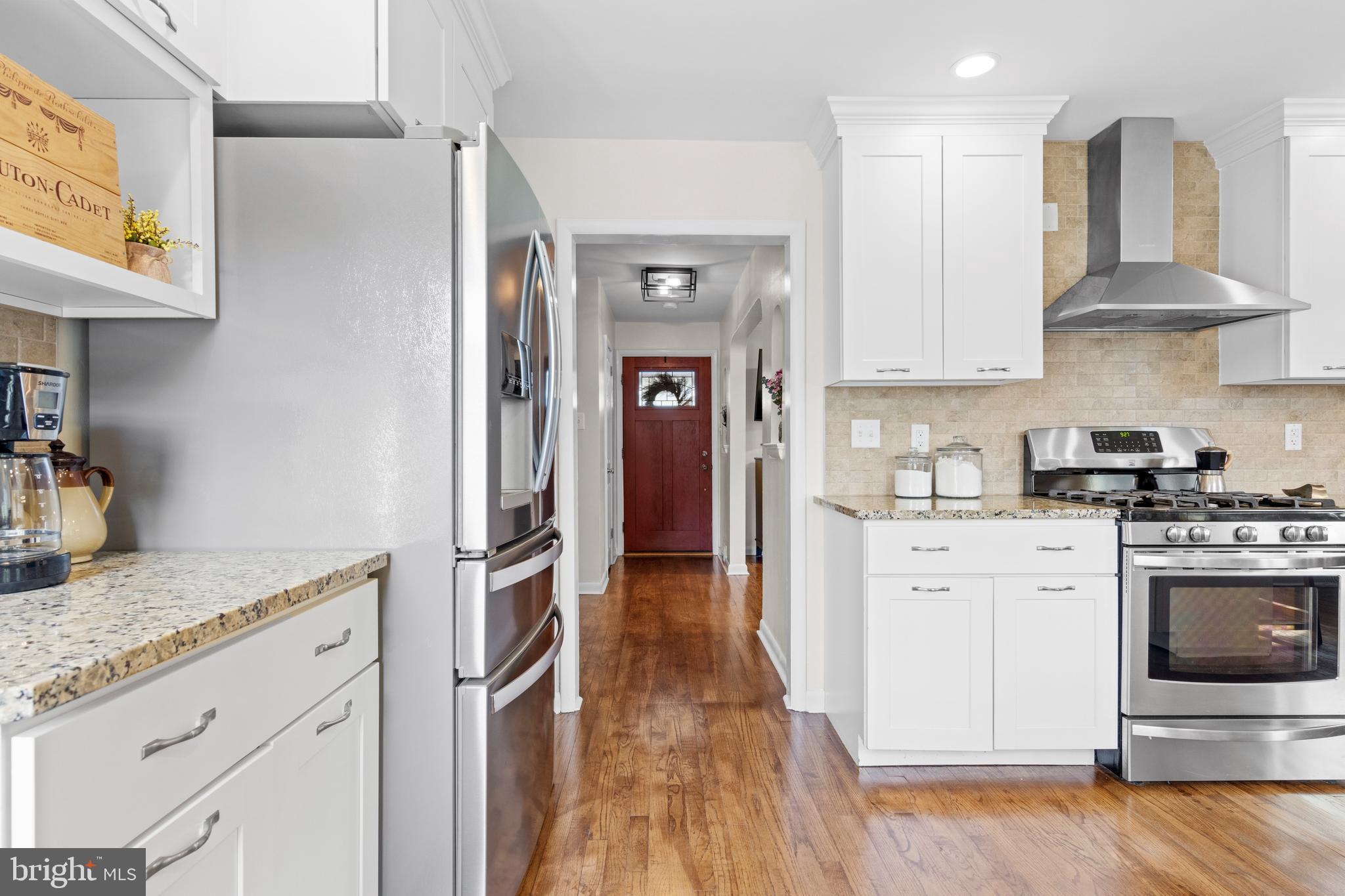 502 Ridge Avenue Kennett Square, PA 19348 - Photo 25 of 60 a kitchen with stainless steel appliances granite countertop a stove and a sink