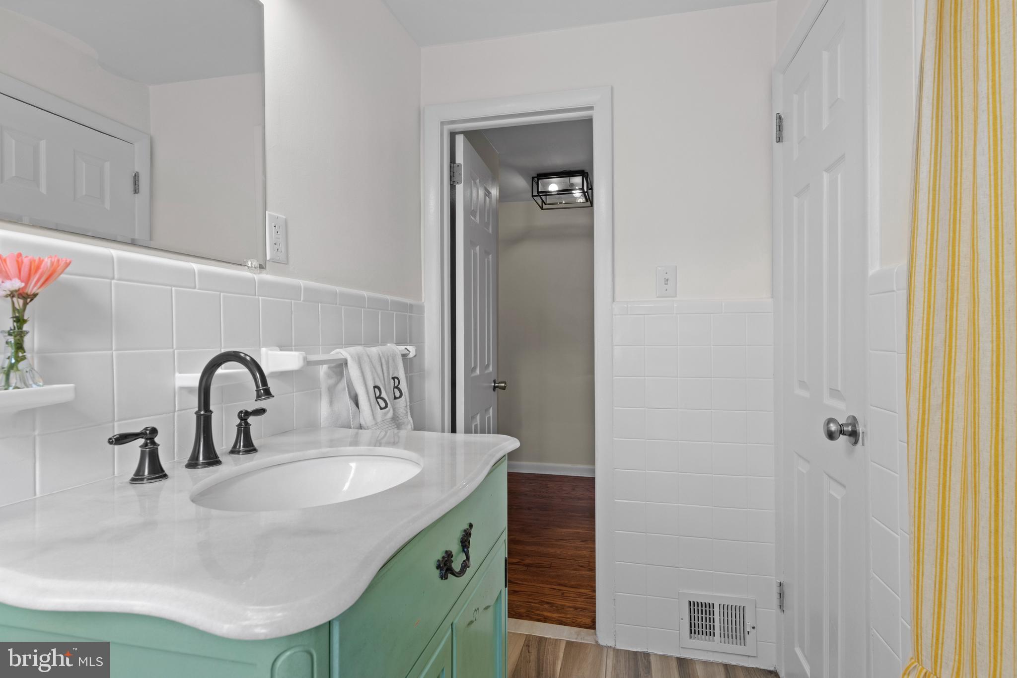502 Ridge Avenue Kennett Square, PA 19348 - Photo 30 of 60 a bathroom with a sink and a mirror