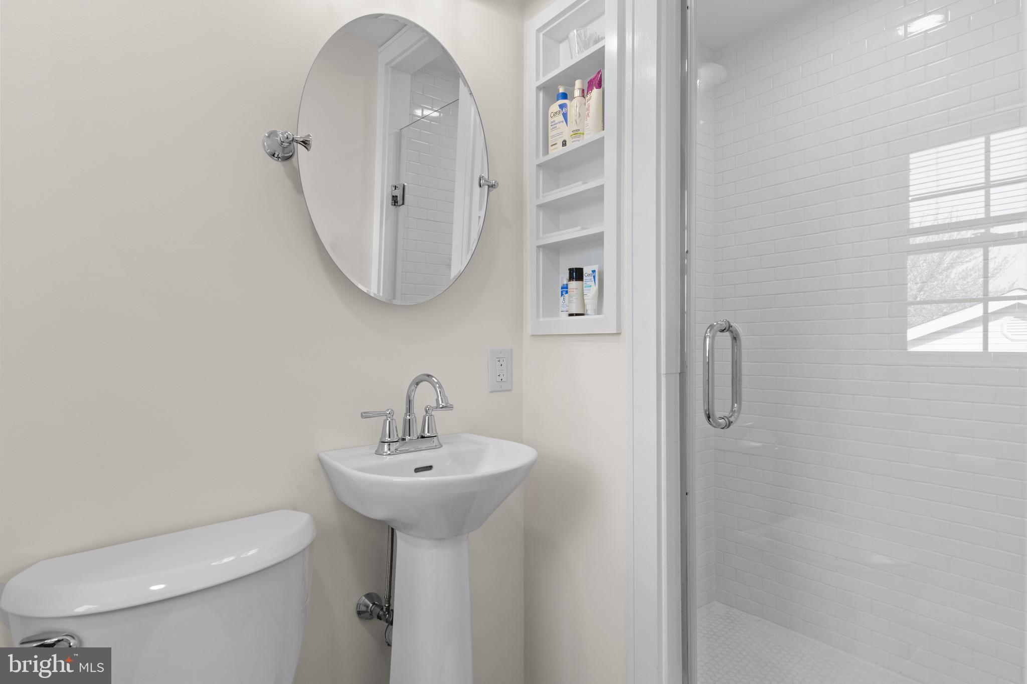 502 Ridge Avenue Kennett Square, PA 19348 - Photo 34 of 60 a bathroom with a sink toilet and a mirror