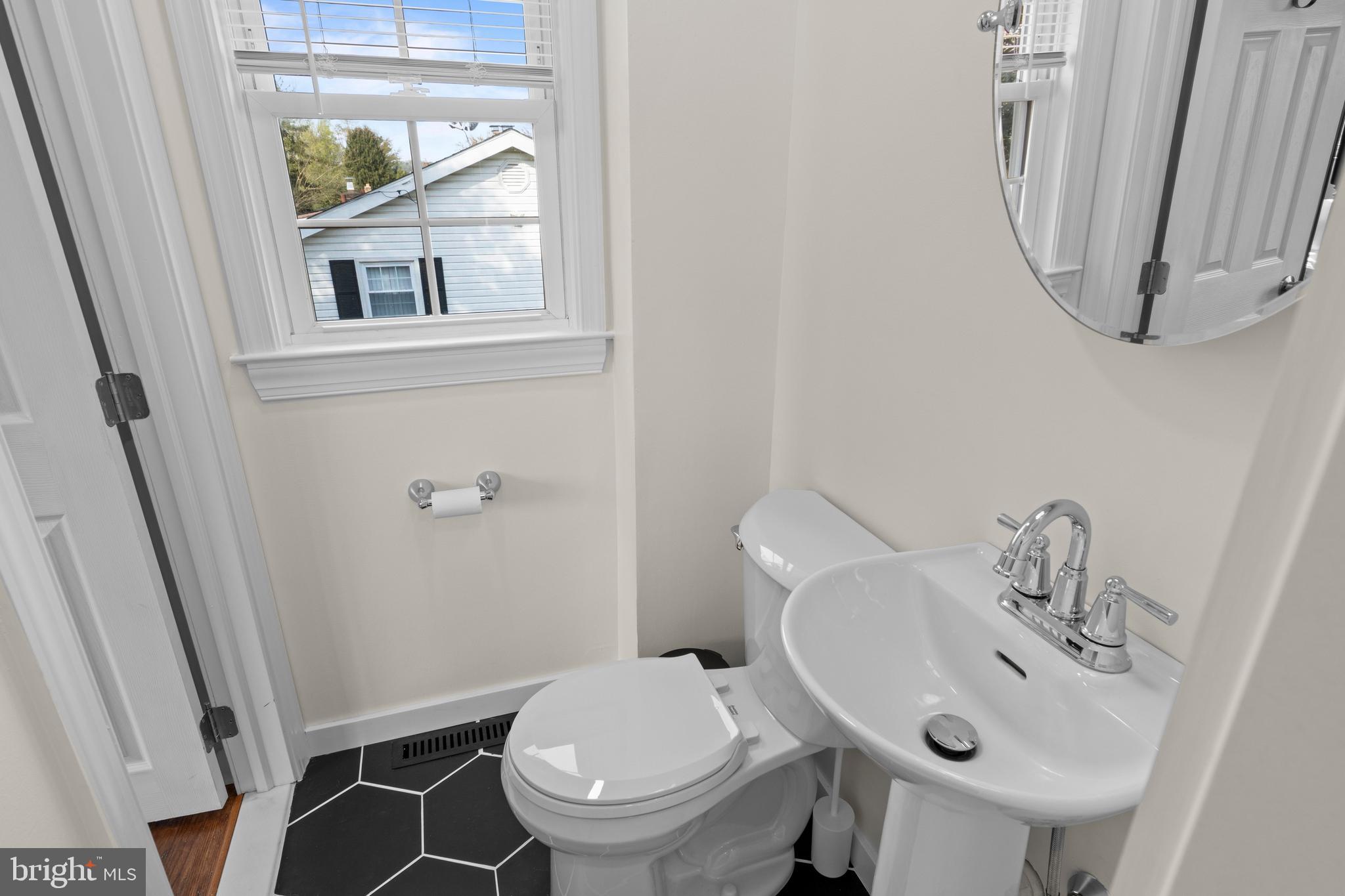 502 Ridge Avenue Kennett Square, PA 19348 - Photo 35 of 60 a bathroom with a sink and a mirror