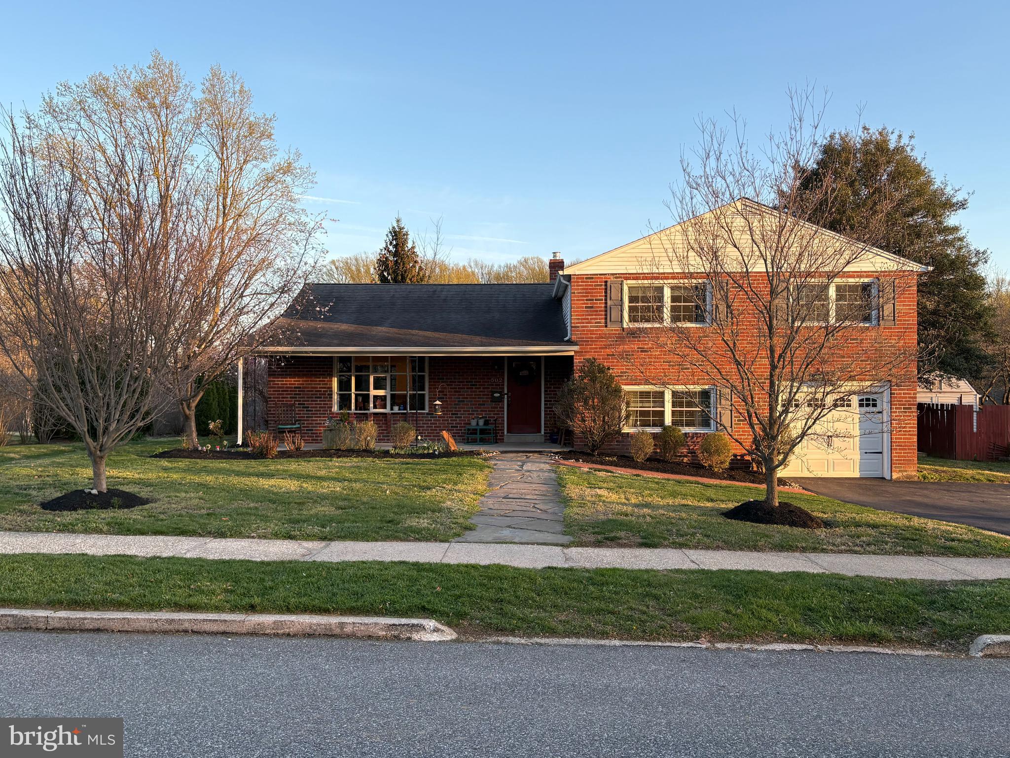 502 Ridge Avenue Kennett Square, PA 19348 - Photo 4 of 60 a front view of a house with a yard