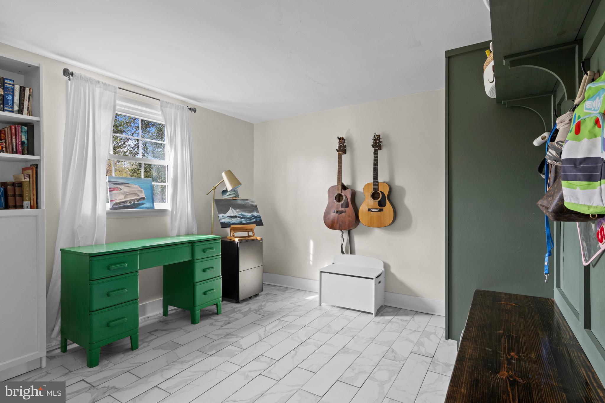 502 Ridge Avenue Kennett Square, PA 19348 - Photo 45 of 60 a room with lots of white furniture and a window