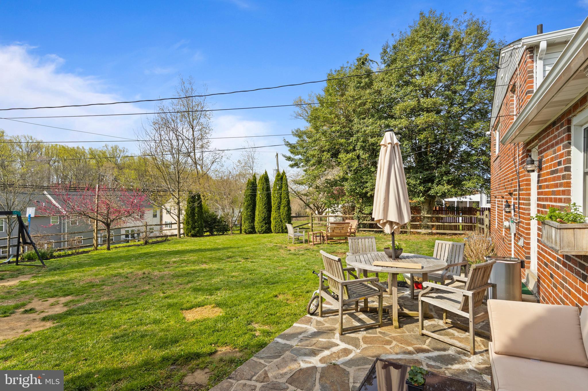 502 Ridge Avenue Kennett Square, PA 19348 - Photo 53 of 60 a view of a patio with table and chairs and floor to ceiling window