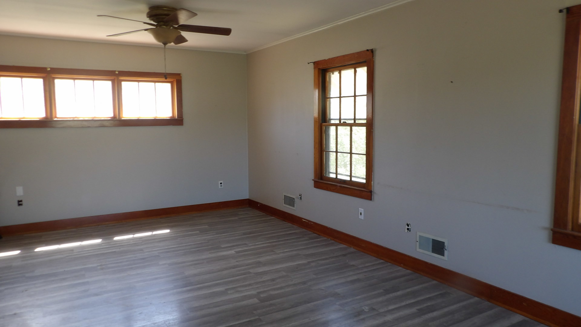 606 Bohn Street Rosiclare, IL 62982 - Photo 12 of 12 a view of an empty room with wooden floor and a window
