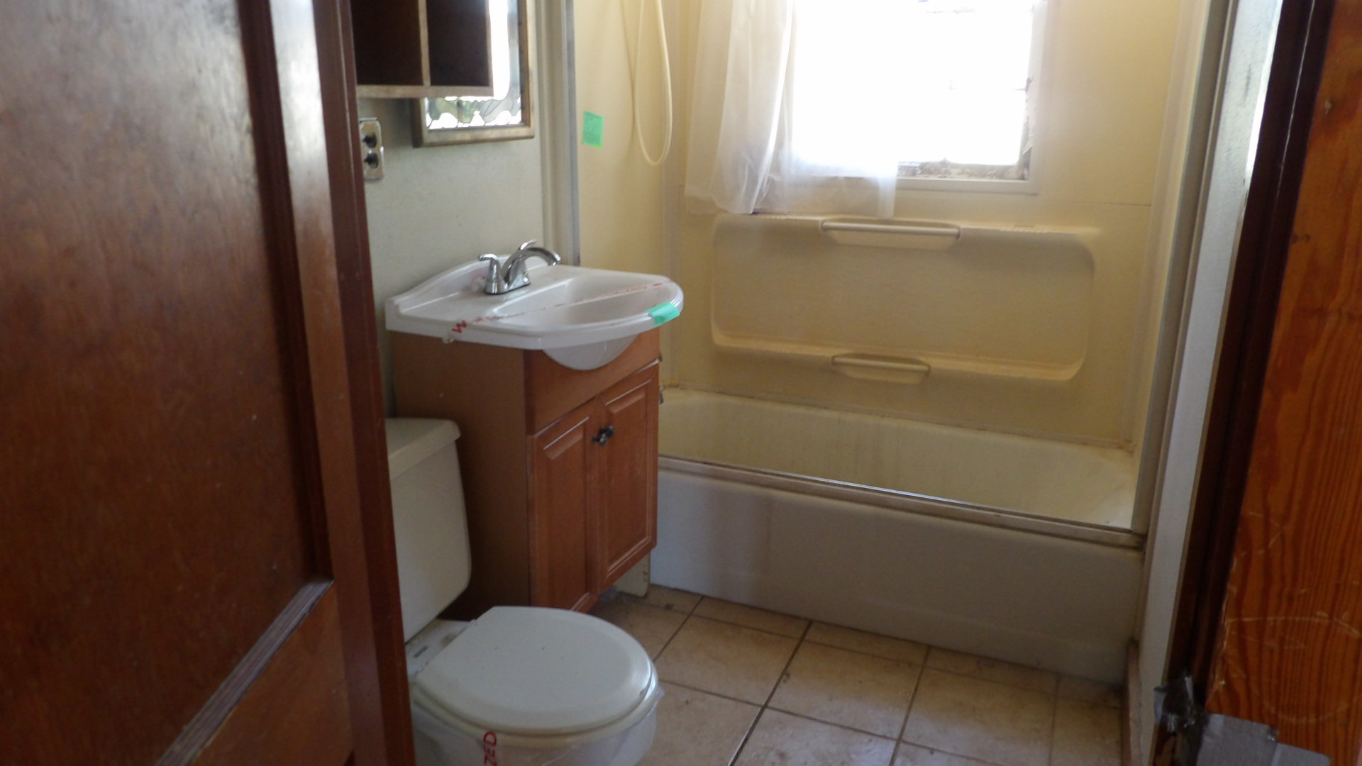 606 Bohn Street Rosiclare, IL 62982 - Photo 8 of 12 a bathroom with a sink toilet and shower
