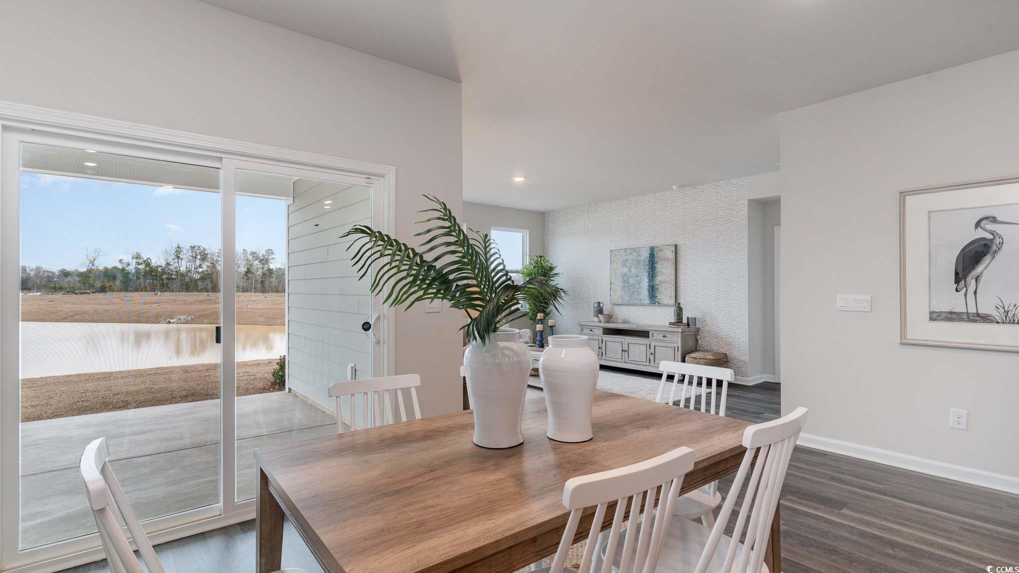 2844 Riverboat Way Conway, SC 29526 - Photo 8 of 24 Dining room with a water view and dark hardwood /