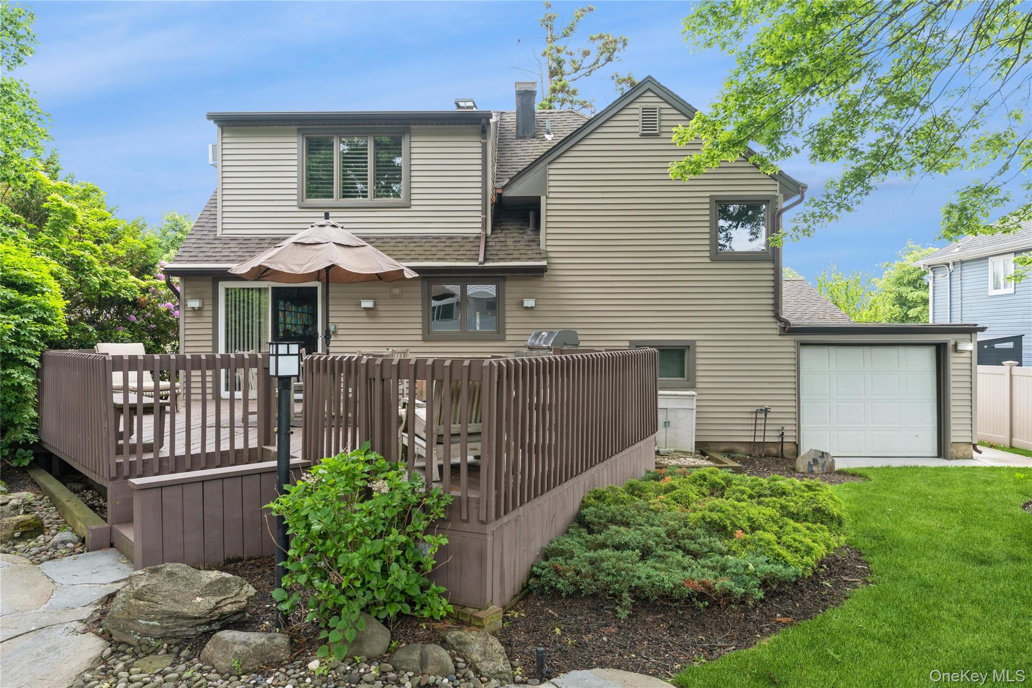 2772 Riverside Avenue Merrick, NY 11566 - Photo 23 of 45 a front view of house with yard and green space