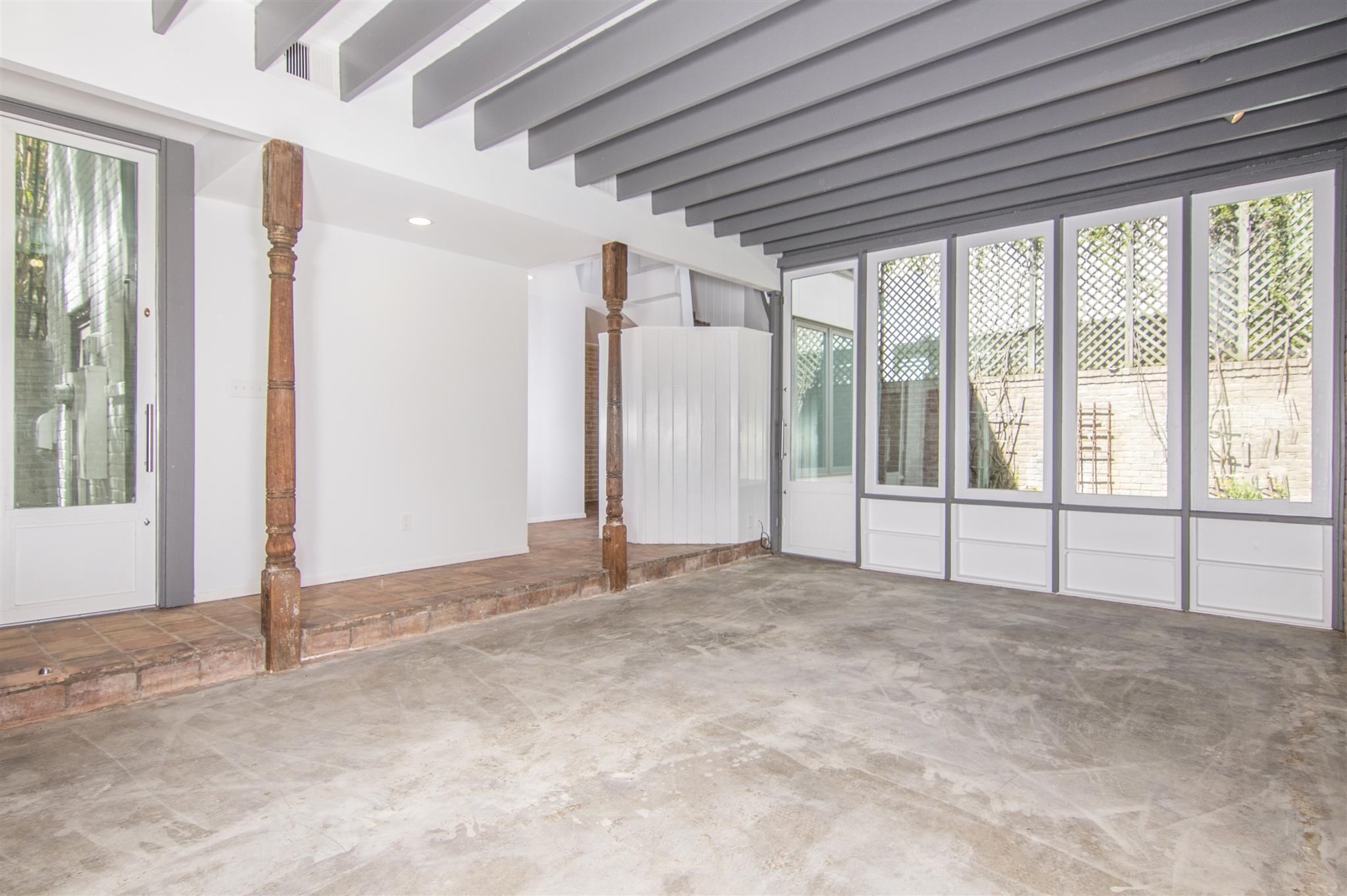 1942 Indiana Street Houston, TX 77019 - Photo 21 of 40 View of spacious living room from the front, toward the backyard. There's plenty of room to spread out while working from home and distance learning from home.