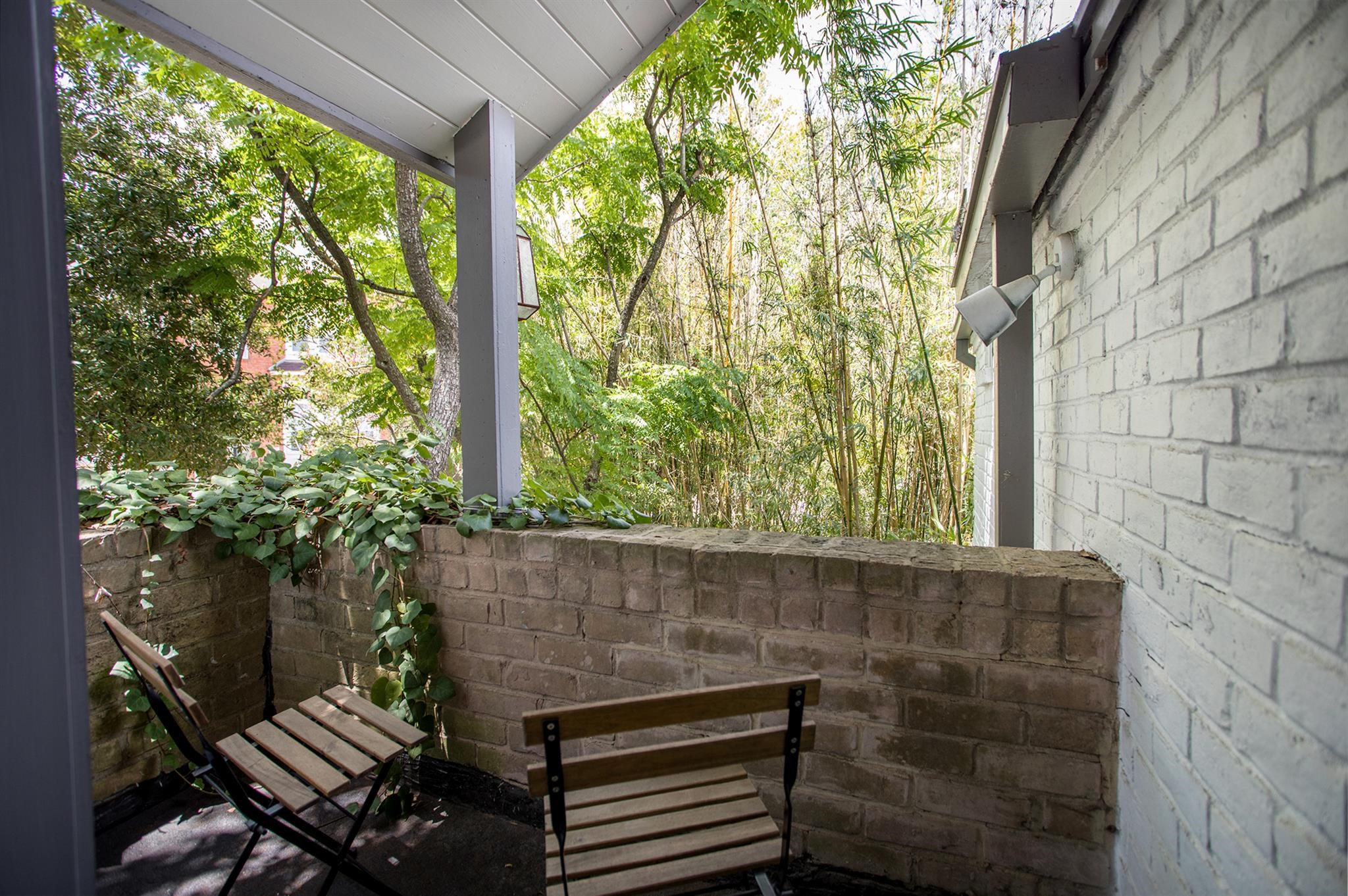 1942 Indiana Street Houston, TX 77019 - Photo 33 of 40 Serene balcony off the primary bedroom - private and quiet.