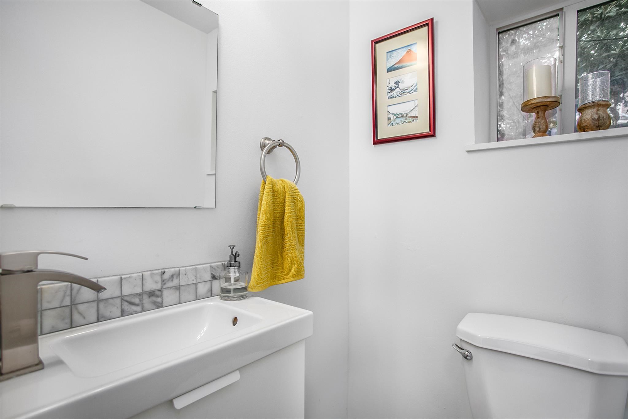 1942 Indiana Street Houston, TX 77019 - Photo 39 of 40 a bathroom with a sink and a mirror