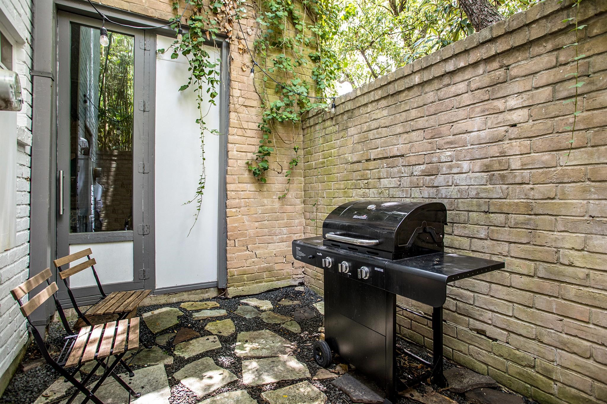 1942 Indiana Street Houston, TX 77019 - Photo 8 of 40 One of three outdoor spaces, this one is conveniently located outside from the kitchen (door from kitchen is to the left, not visible in this photo), and also accessible from the foyer/living room.