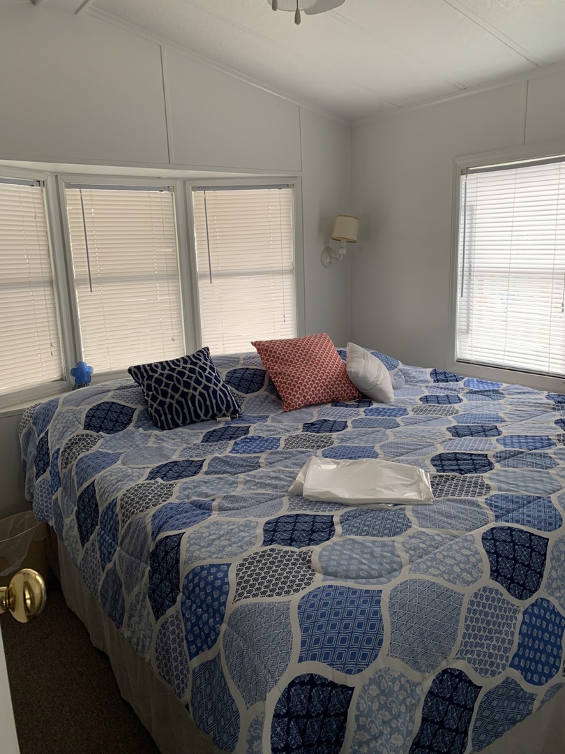 5-125 Woodhaven Sublette, IL 61367 - Photo 16 of 19 a bedroom with a bed a couch and next to a window