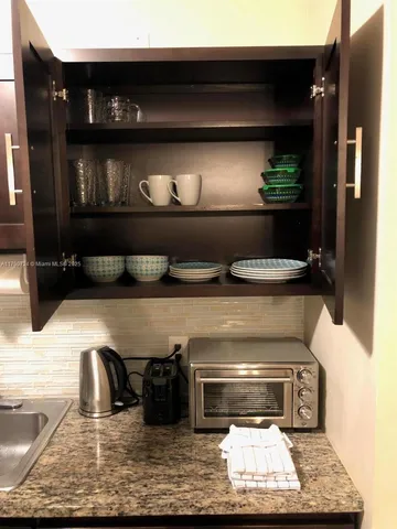 a kitchen with a stove and cabinets