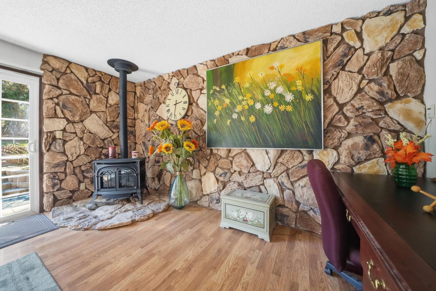 23420 Robin Road Pioneer, CA 95666 - Photo 14 of 43 a living room with a couch and a table with wooden floor