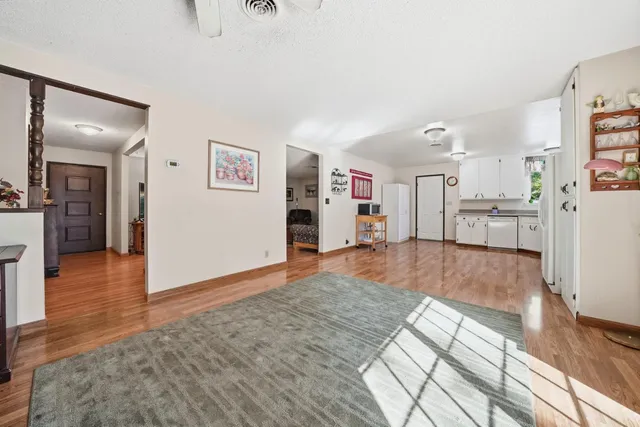 wooden floor in kitchen and a livingroom with furniture wooden floor