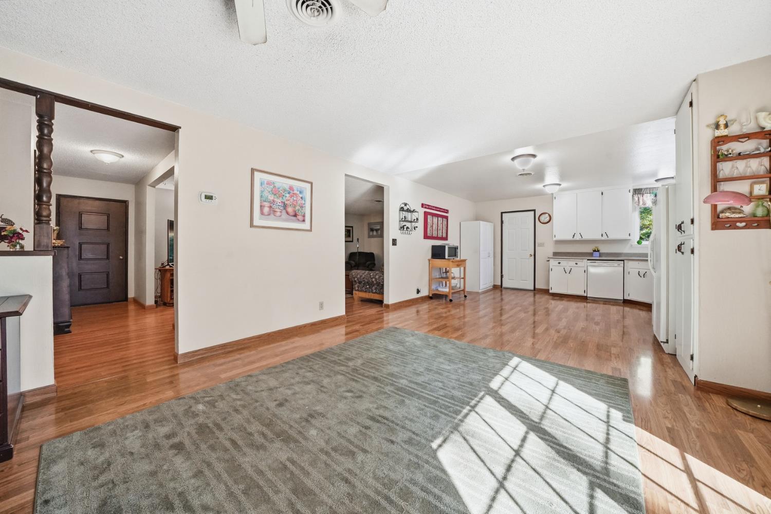 23420 Robin Road Pioneer, CA 95666 - Photo 15 of 43 wooden floor in kitchen and a livingroom with furniture wooden floor