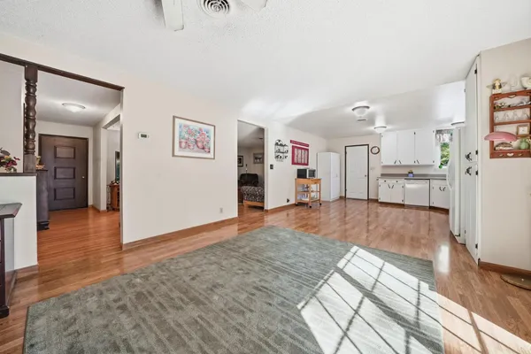wooden floor in kitchen and a livingroom with furniture wooden floor