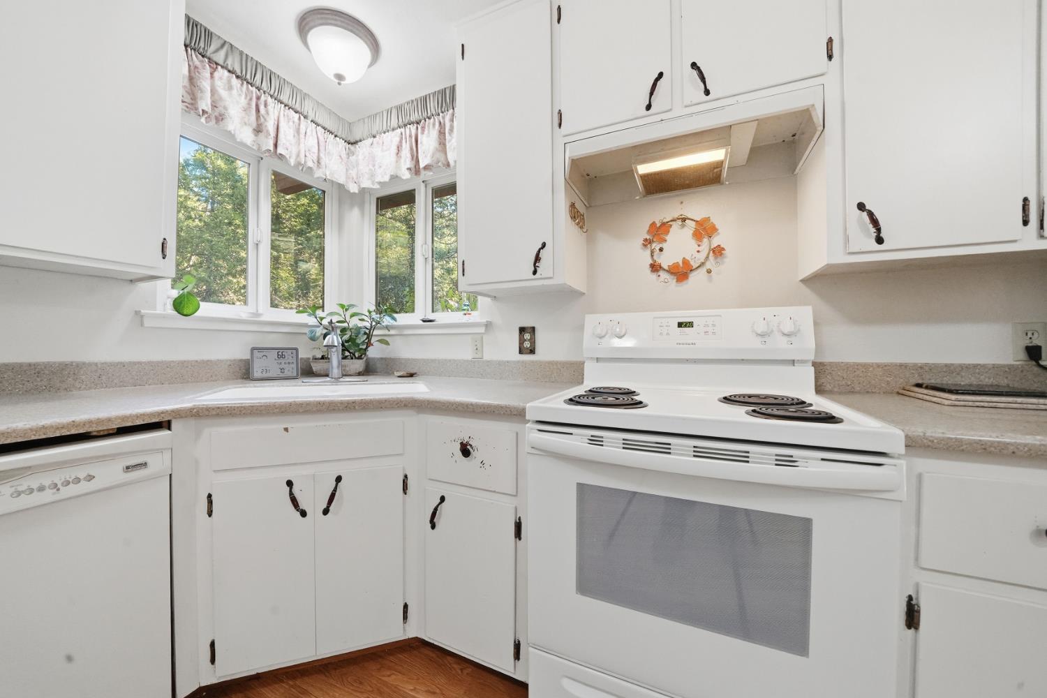 23420 Robin Road Pioneer, CA 95666 - Photo 21 of 43 a kitchen with cabinets appliances and a large window