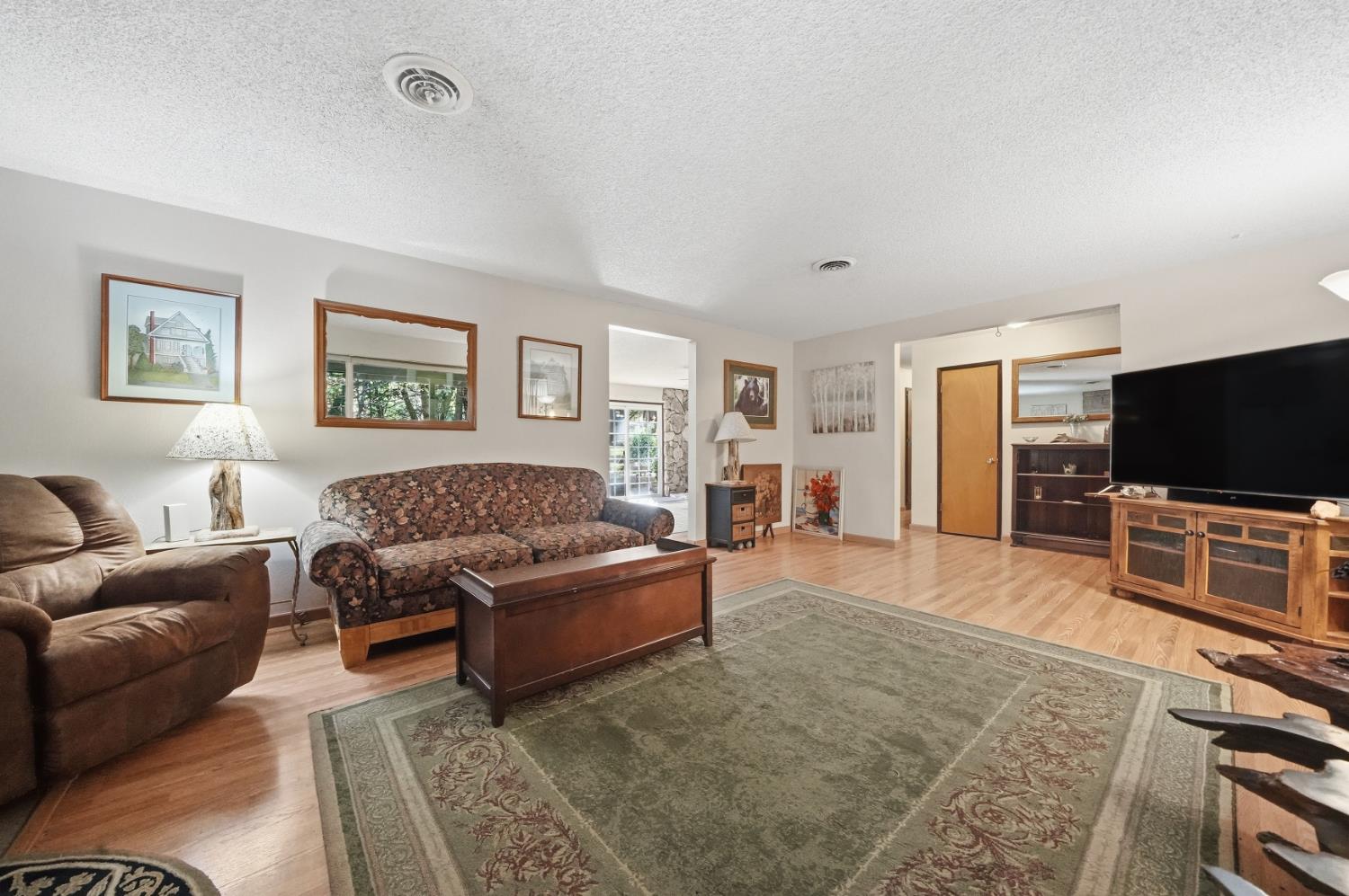 23420 Robin Road Pioneer, CA 95666 - Photo 27 of 43 a living room with furniture and a flat screen tv