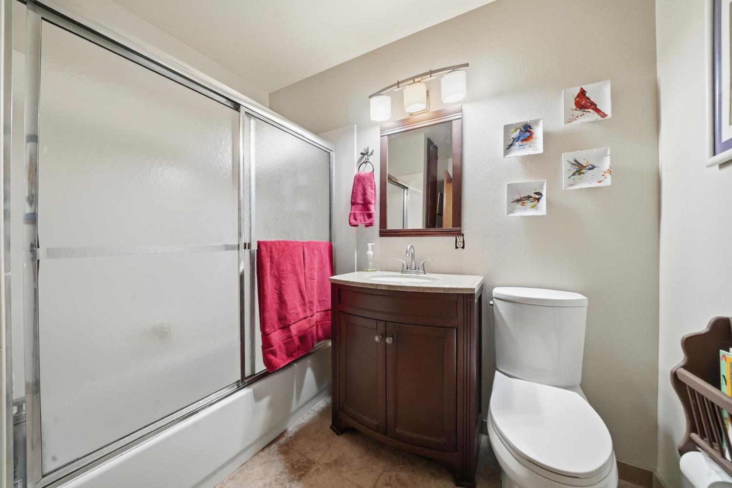 23420 Robin Road Pioneer, CA 95666 - Photo 32 of 43 a bathroom with a toilet a sink and mirror