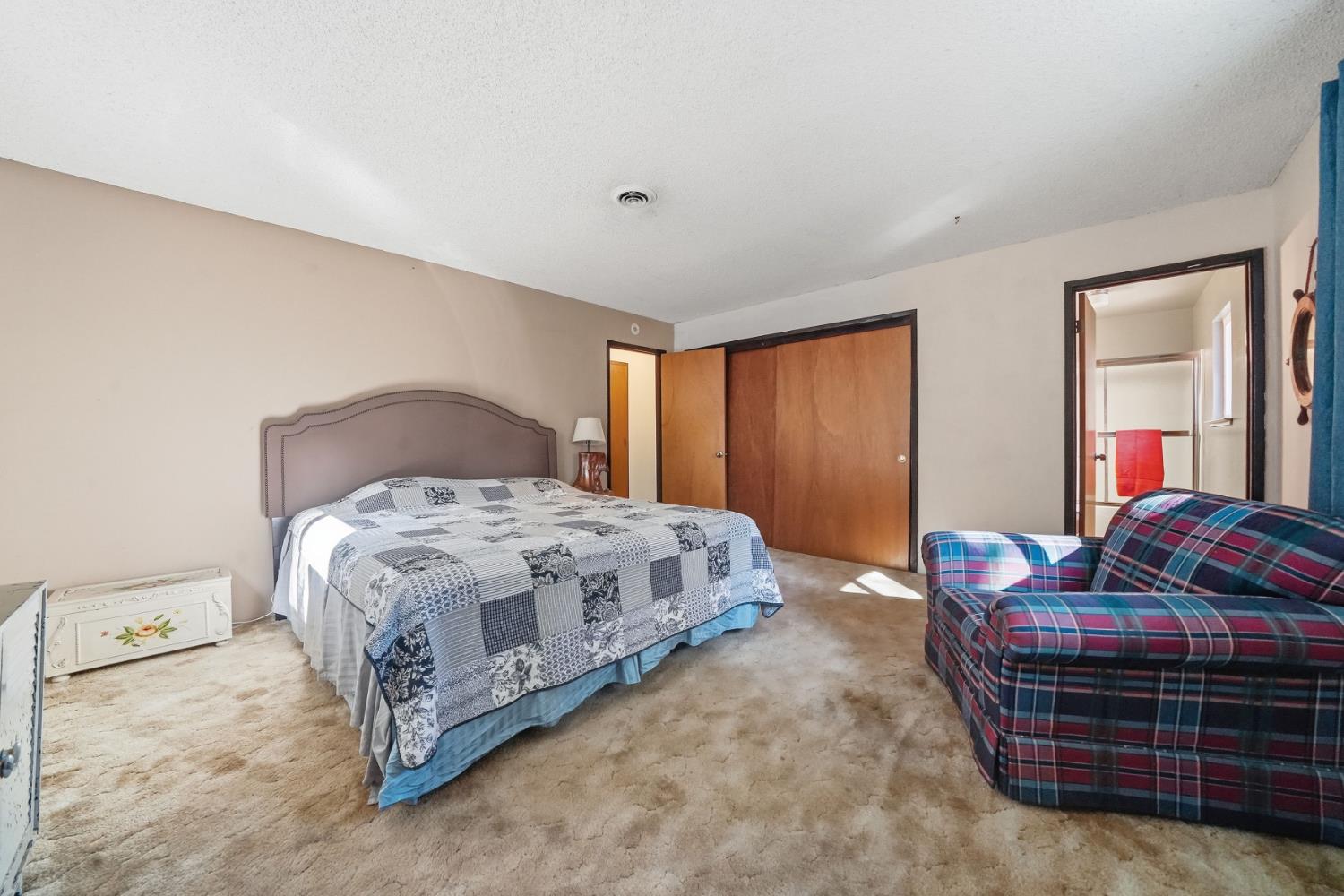 23420 Robin Road Pioneer, CA 95666 - Photo 35 of 43 a bedroom with a bed and a couch