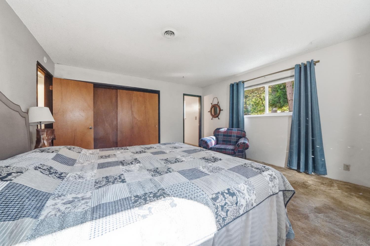 23420 Robin Road Pioneer, CA 95666 - Photo 36 of 43 a bedroom with a bed and a dresser