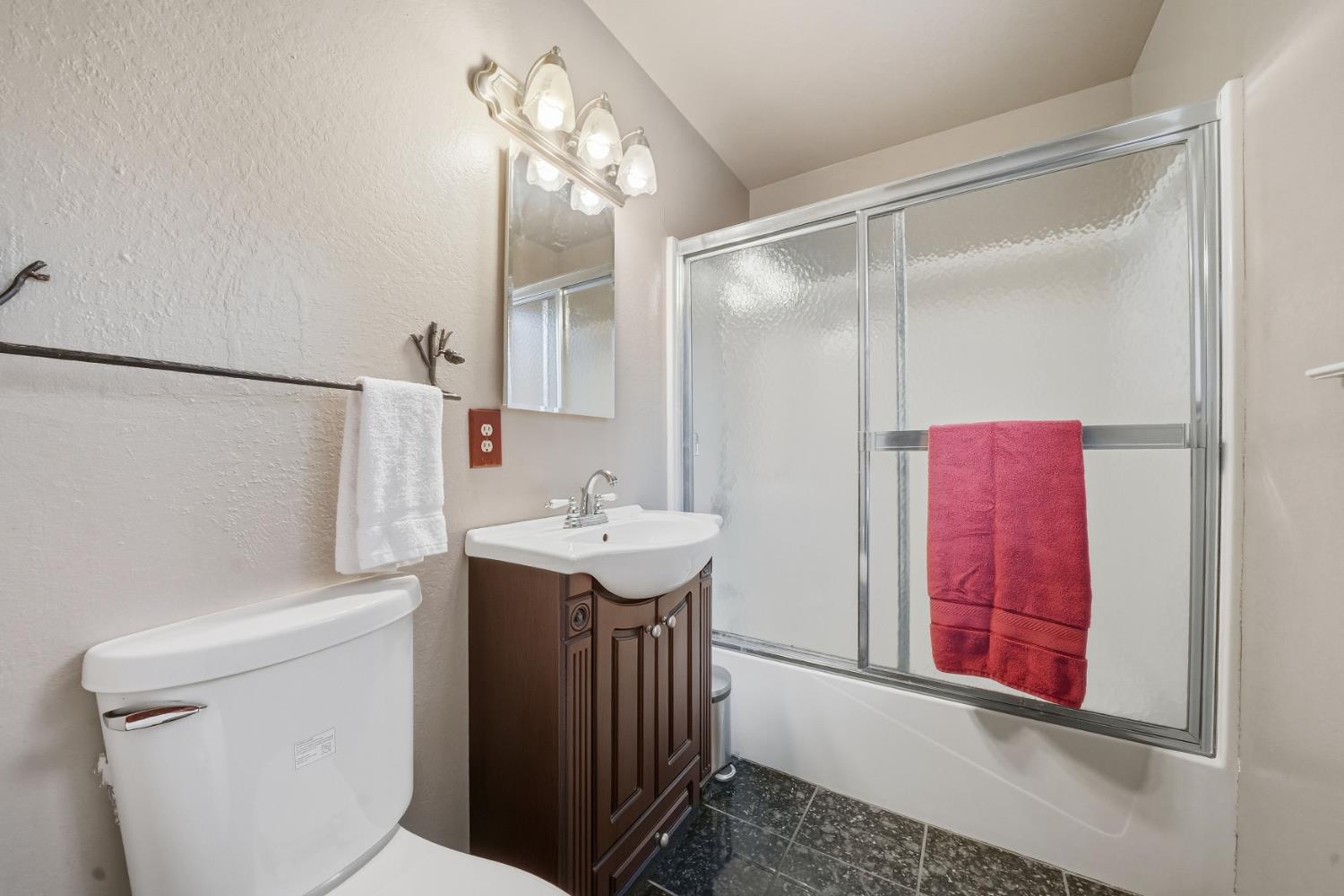 23420 Robin Road Pioneer, CA 95666 - Photo 37 of 43 a bathroom with a sink a toilet and shower