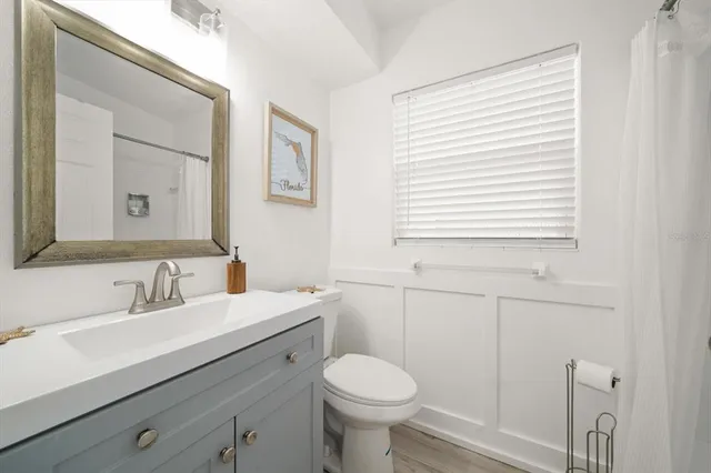 a kitchen with a stove a sink and a refrigerator