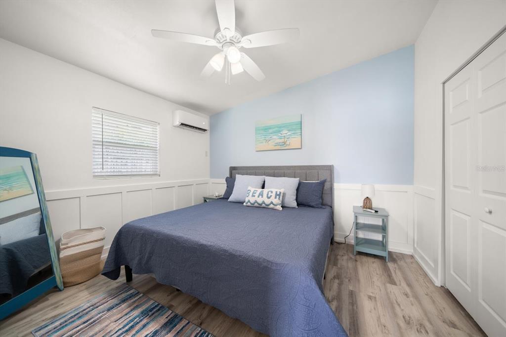 711 East Gulf Boulevard Indian Rocks Beach, FL 33785 - Photo 23 of 35 a bedroom with a bed and a window