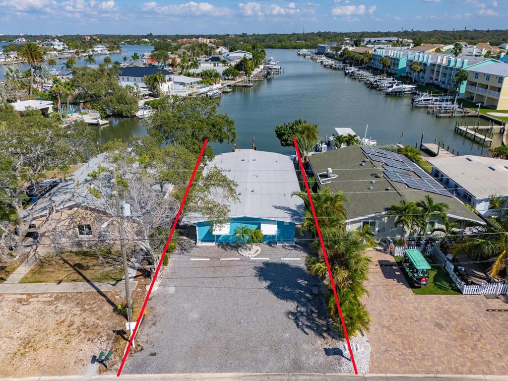 711 East Gulf Boulevard Indian Rocks Beach, FL 33785 - Photo 4 of 35 an aerial view of a house with a lake view