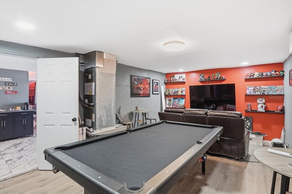 3208 Kilburn Road Holiday, FL 34691 - Photo 14 of 17 a living room with furniture and a flat screen tv