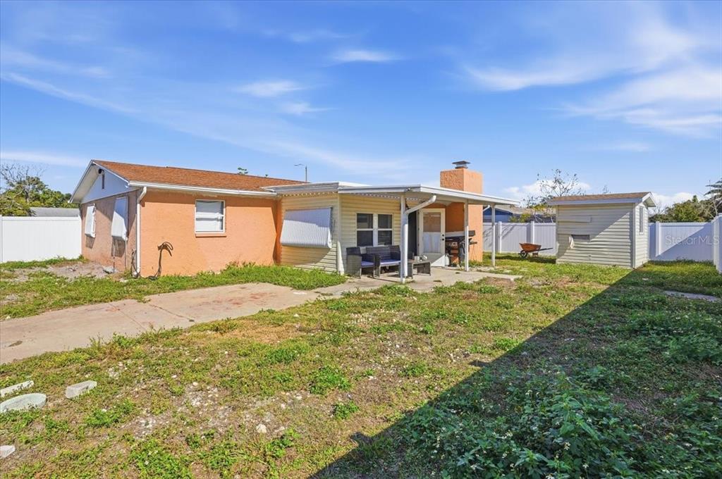 3208 Kilburn Road Holiday, FL 34691 - Photo 2 of 17 a front view of a house with a garden