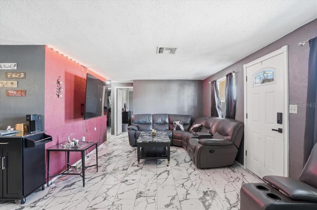 3208 Kilburn Road Holiday, FL 34691 - Photo 7 of 17 a living room with furniture