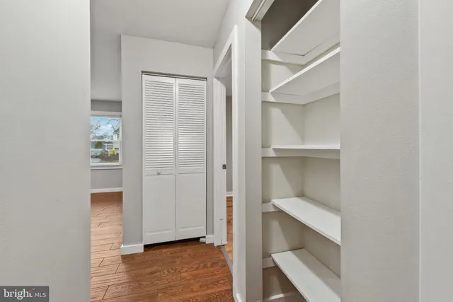 a view of an empty walk in closet