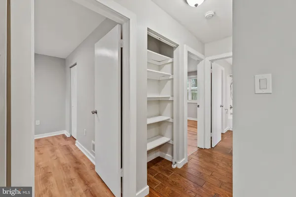 a view of a bedroom from a hallway