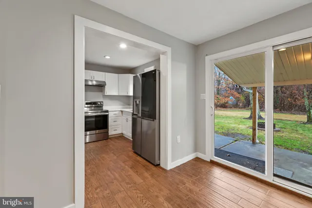 a view of kitchen with wooden floor