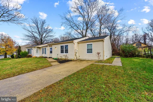 a view of a yard with a house and garden