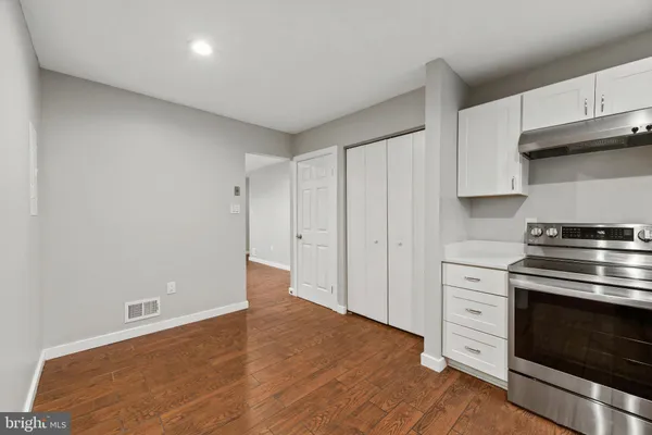 a view of a kitchen with electric appliances