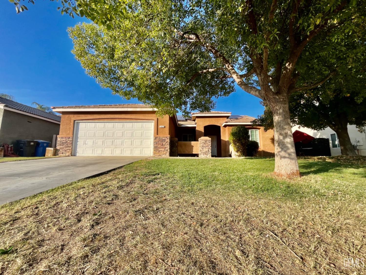 Undisclosed Address Arvin, CA 93203 - Photo 1 of 5 a front view of a house with a yard and garage