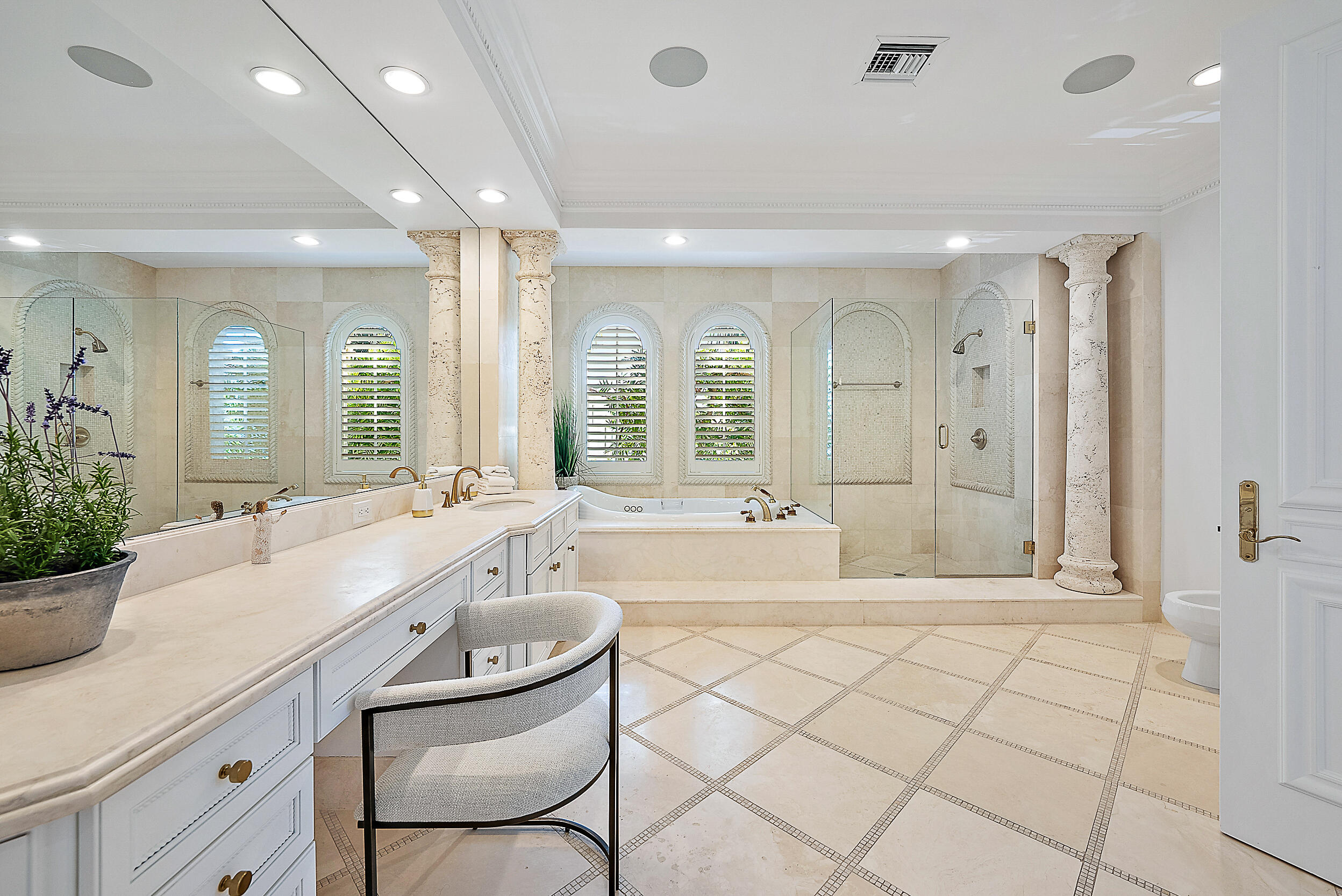 314 Chilean Avenue Palm Beach, FL 33480 - Photo 25 of 46 a large bathroom with a double vanity sink a mirror and a bathtub