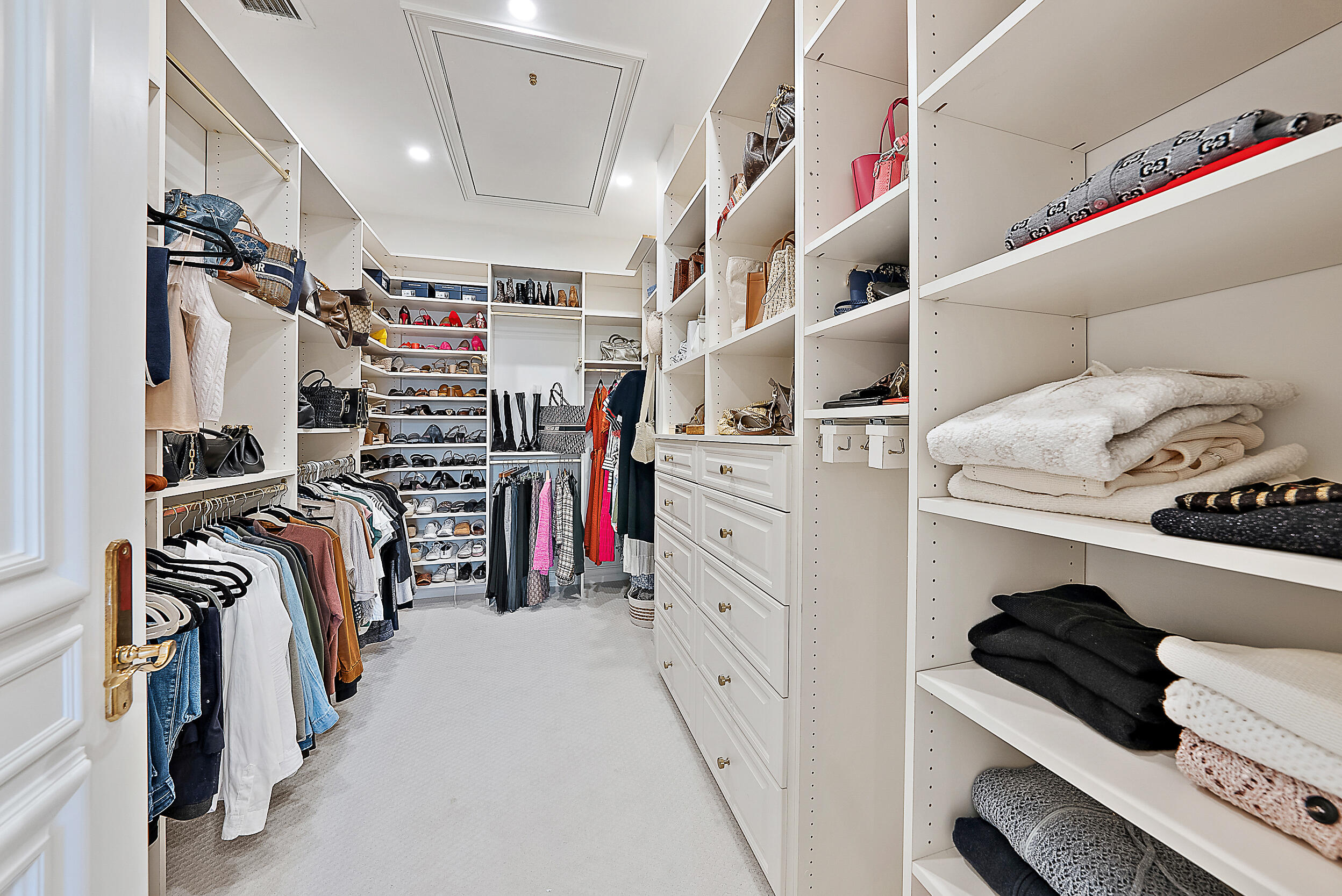 314 Chilean Avenue Palm Beach, FL 33480 - Photo 26 of 46 a storage room with washer and dryer