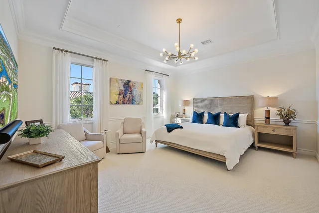 a spacious bedroom with a bed and window