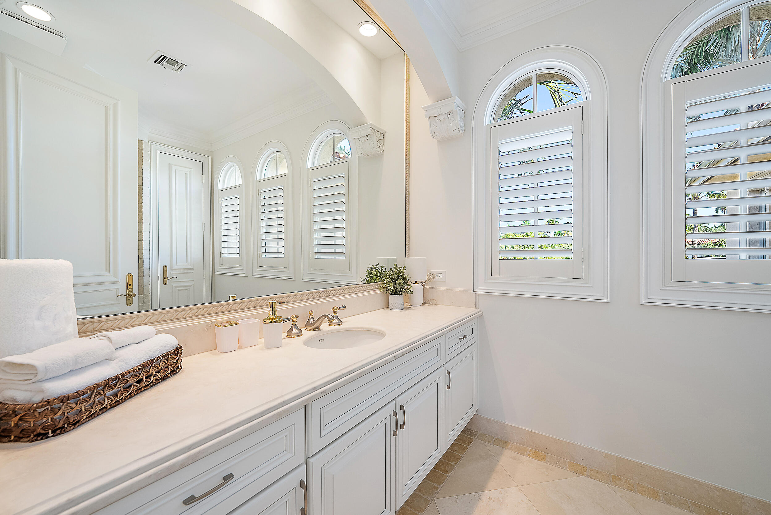 314 Chilean Avenue Palm Beach, FL 33480 - Photo 31 of 46 a spacious bathroom with double vanity and a mirror