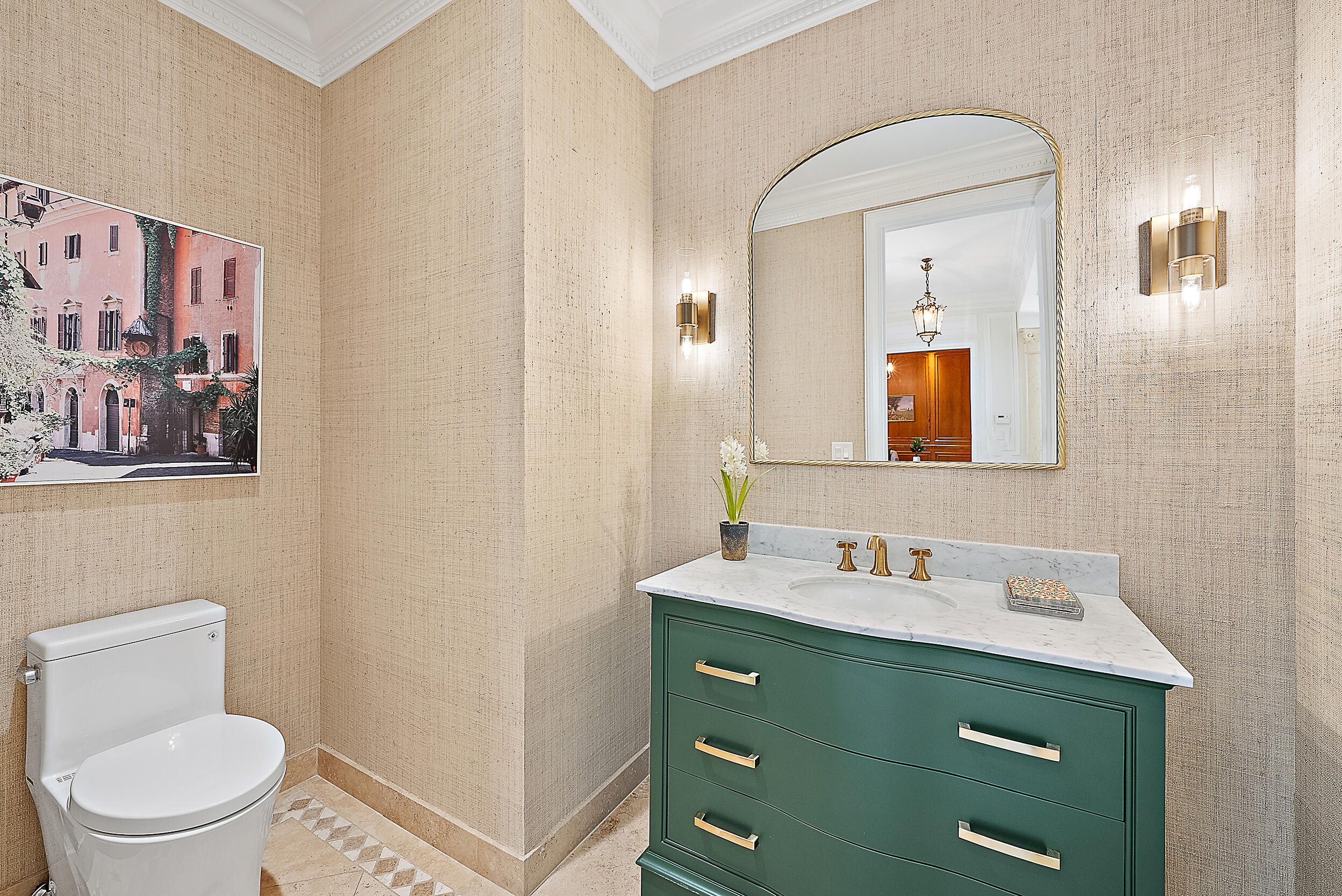 314 Chilean Avenue Palm Beach, FL 33480 - Photo 34 of 46 a bathroom with a toilet sink and mirror