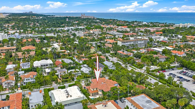 an aerial view of residential houses with city view