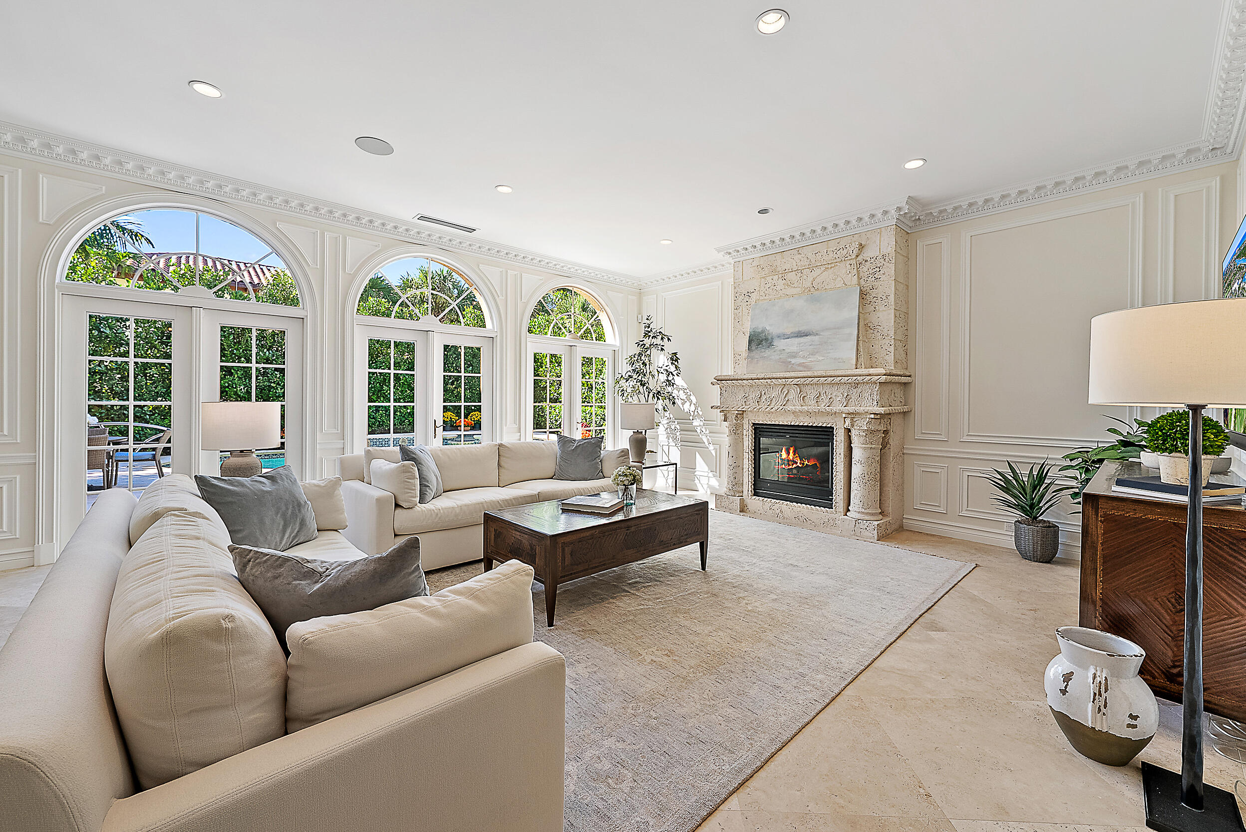 314 Chilean Avenue Palm Beach, FL 33480 - Photo 9 of 46 a living room with furniture a fireplace and a floor to ceiling window