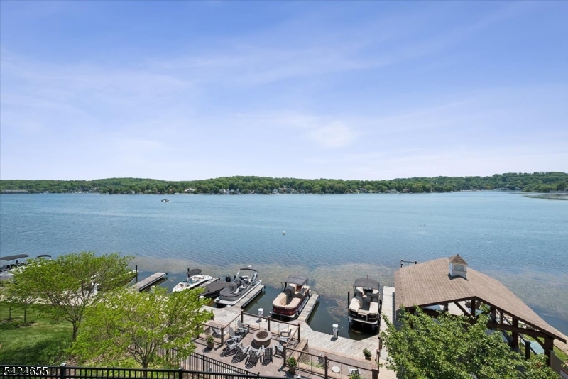 401 Mariners Pointe Hopatcong, NJ 07843 - Photo 21 of 42 a aerial view of a lake with houses in the back