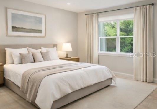 2352 Lorena Lane Clearwater, FL 33765 - Photo 2 of 5 a bedroom with a bed and a window